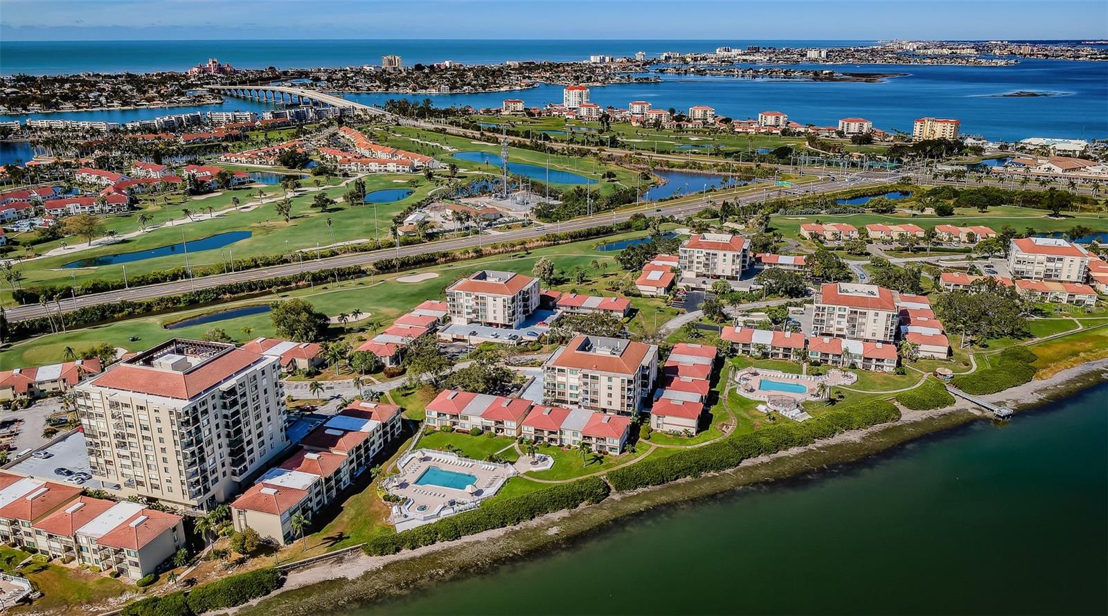 This is the Florida Lifestyle - Heated Pool & Spa Overlooking Tampa Bay and Lush Green Landscaping Everywhere!