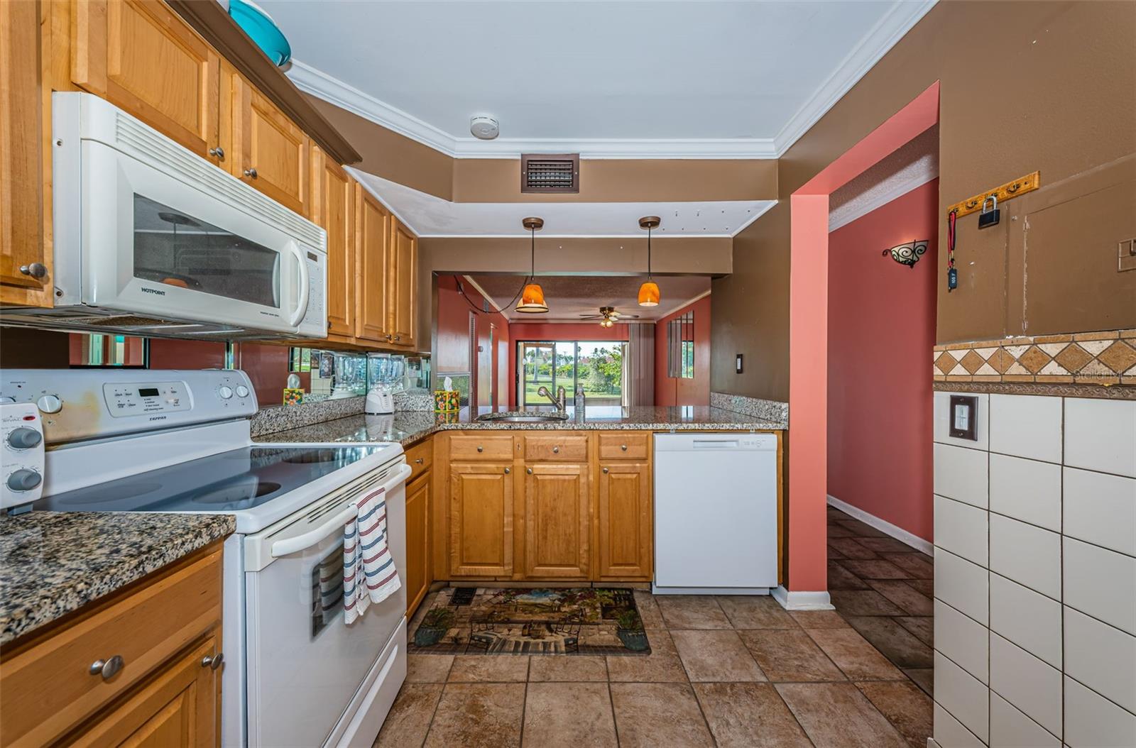 Kitchen with Pretty Cabinetry and  Granite Countertops