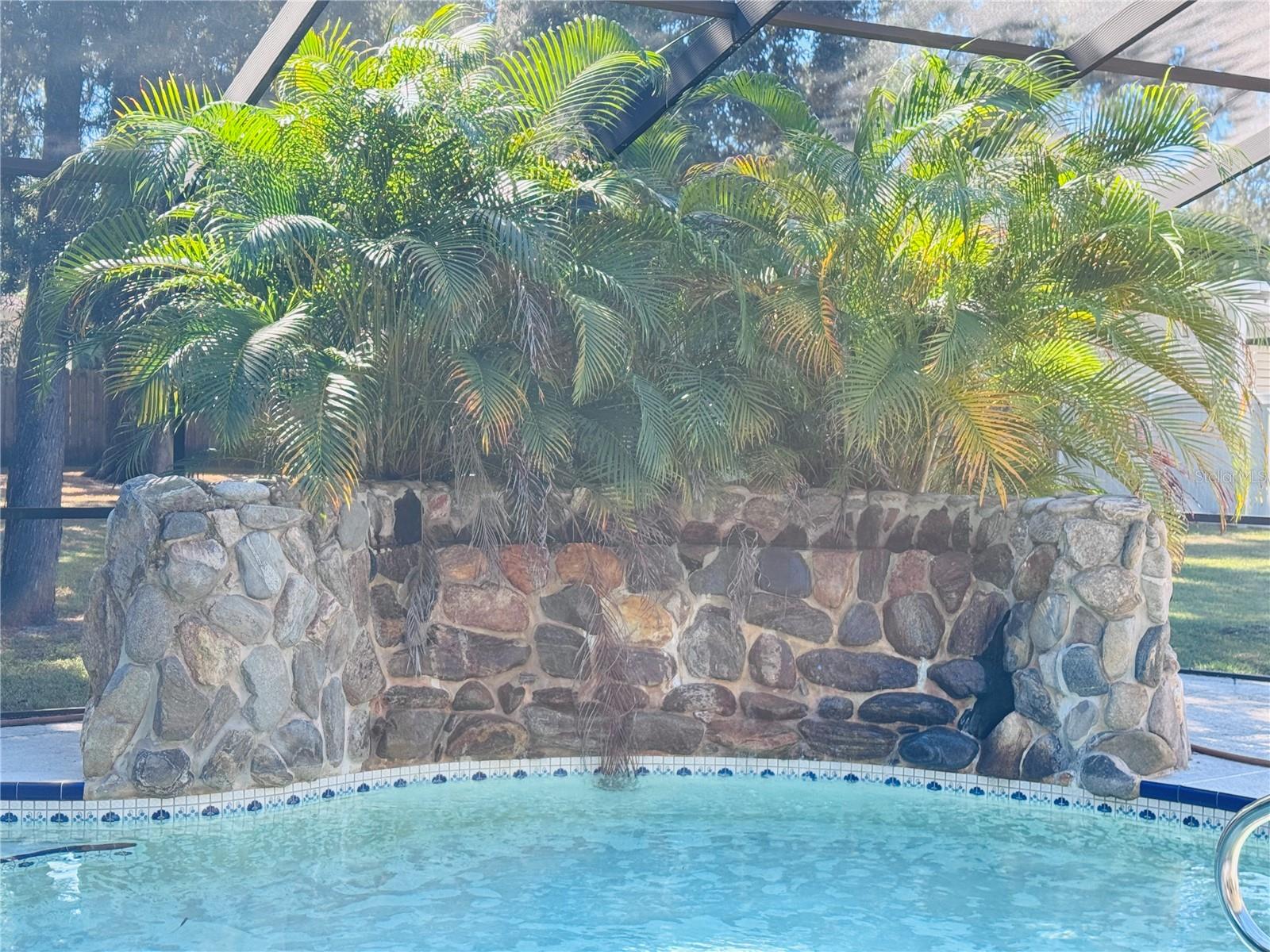 Waterfall Feature with stone located in the pool