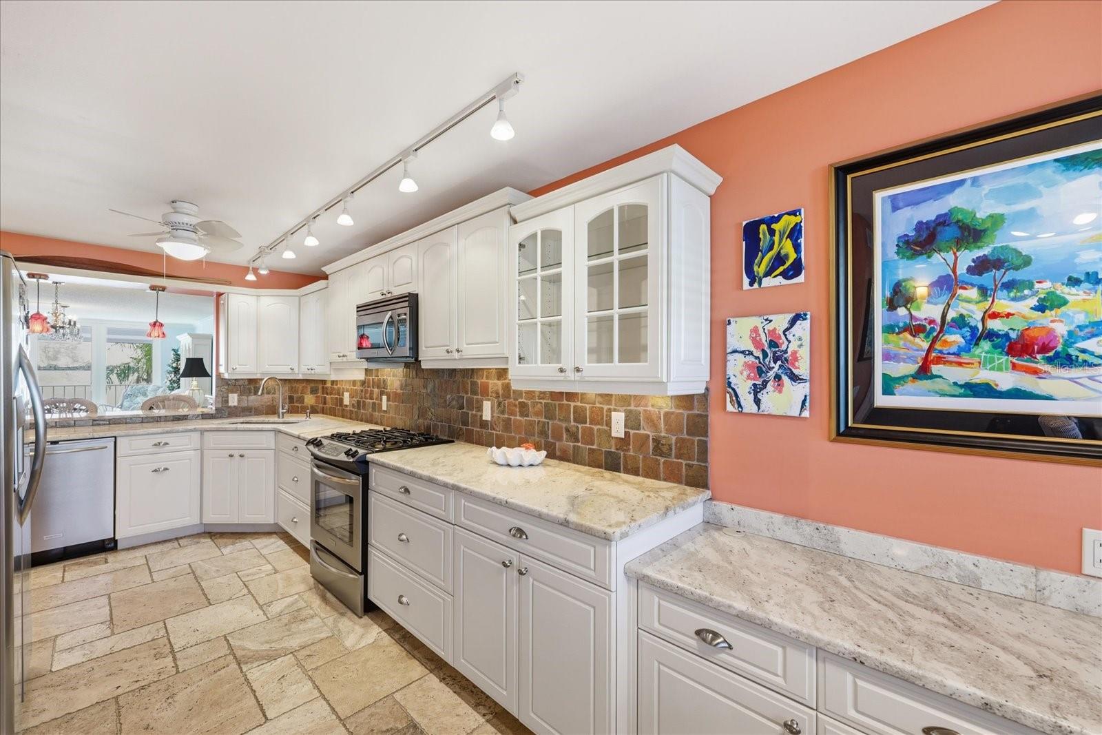 Beautiful, spacious updated kitchen with granite countertops and stainless steel appliances.