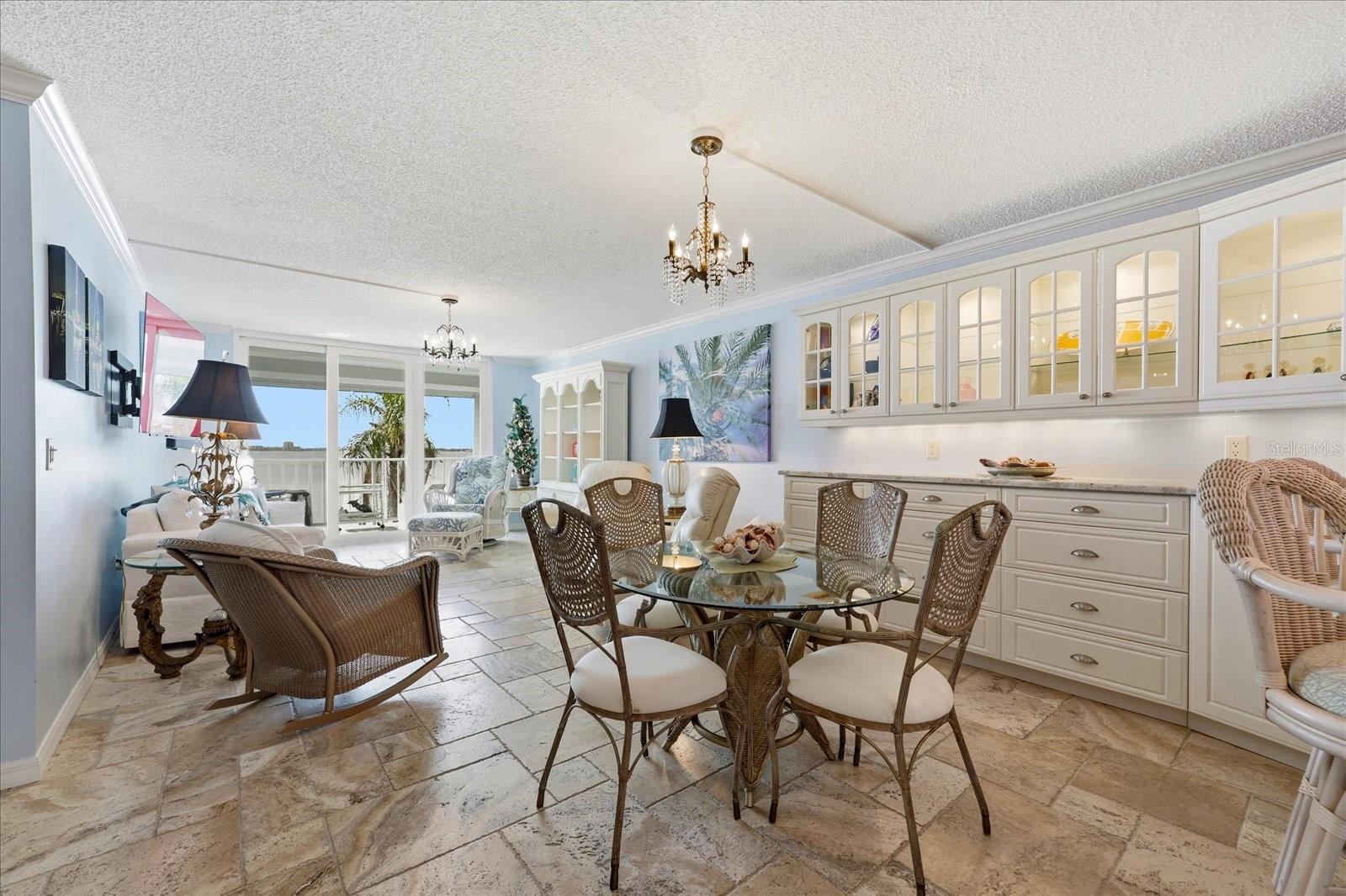 Open concept living/dining area with custom built ins.