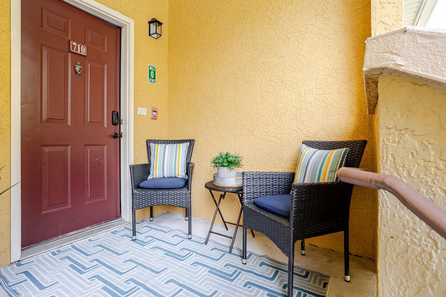 Quiet and private covered porch by entrance.