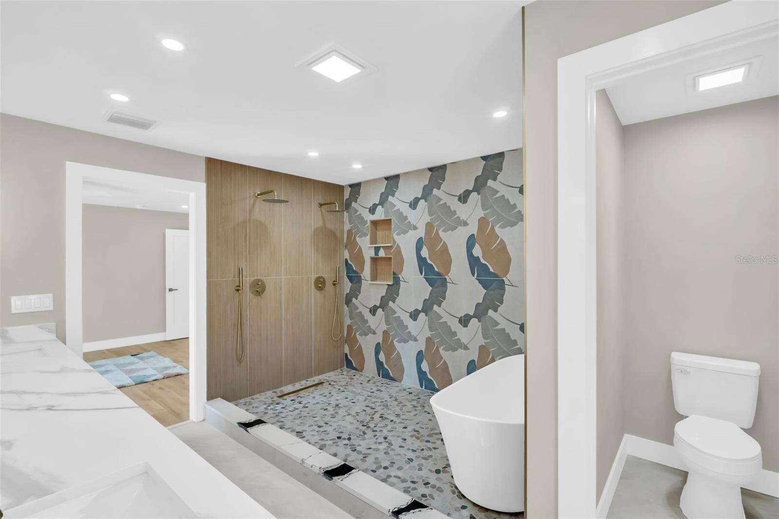 PRIMARY EN SUITE WITH CUSTOM BATH AND WALK IN CLOSET