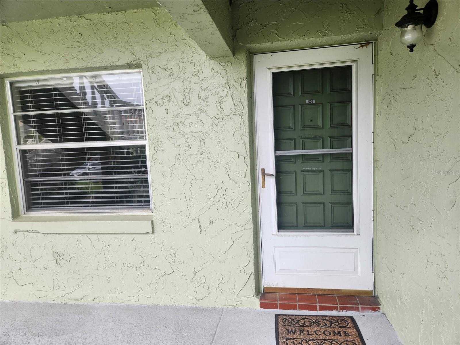 Furnished 1st floor end unit with reserved parking in front