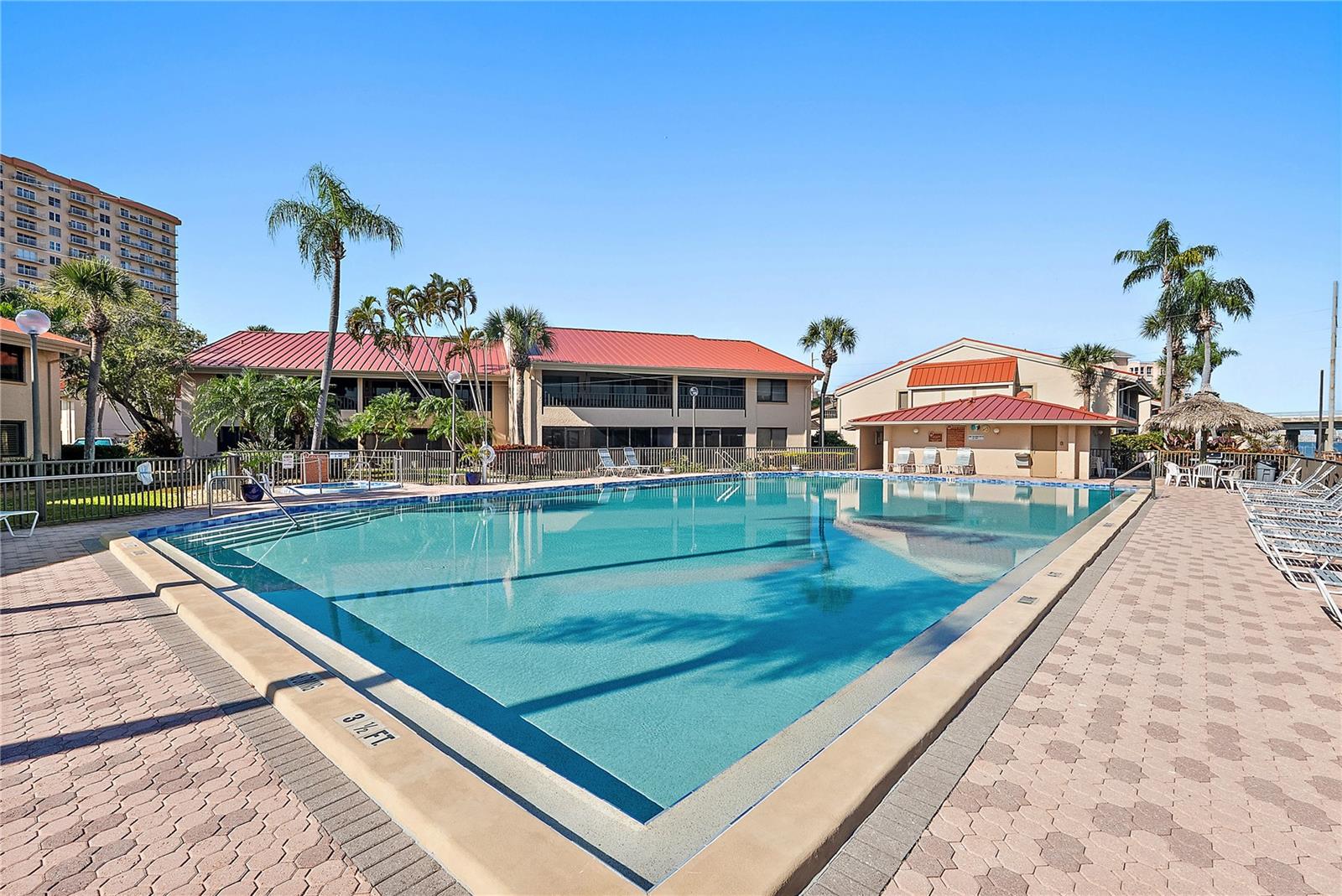 Waterside pool with spa