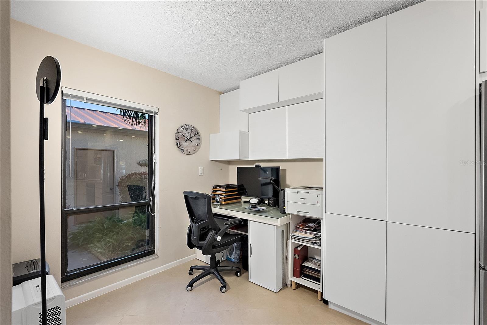 Office area smoothly integrated into the kitchen.