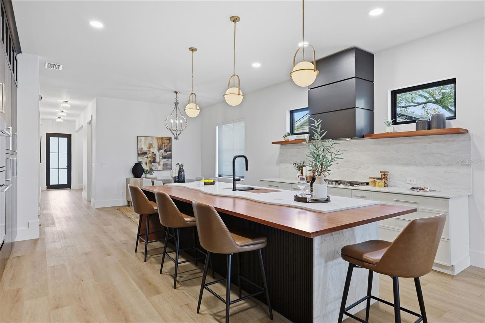 Kitchen with gas cooktop & hood vent