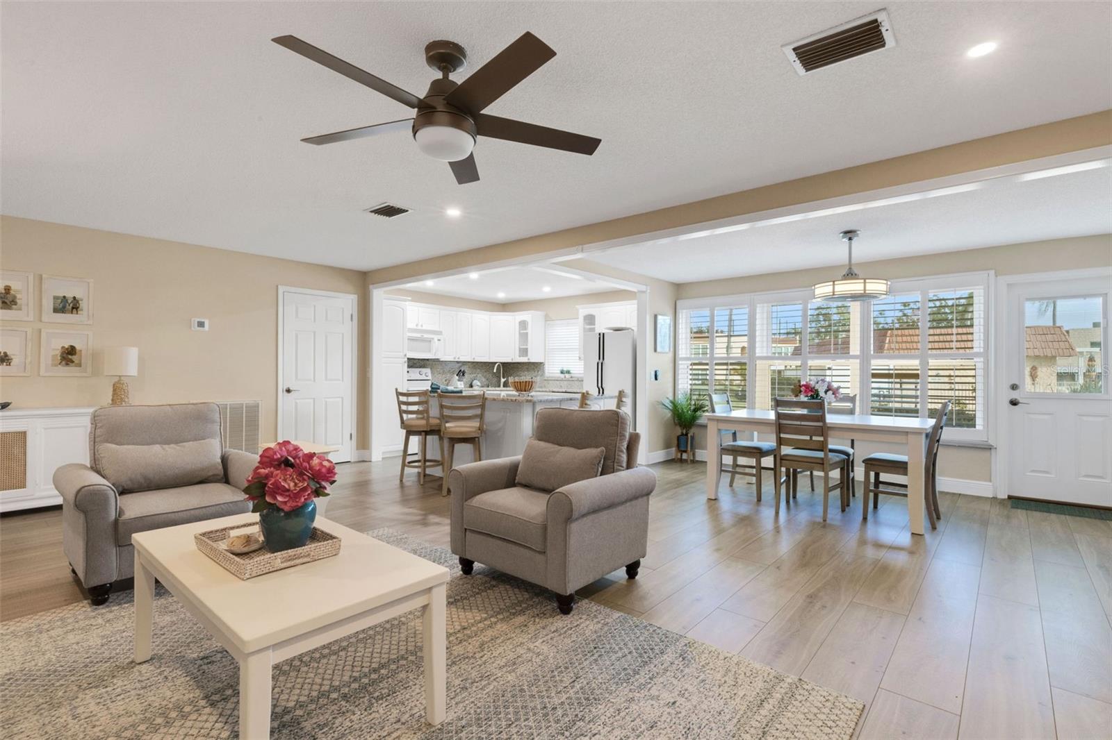 Living Room Looking to Island Kitchen and Florida Room / Dining Room