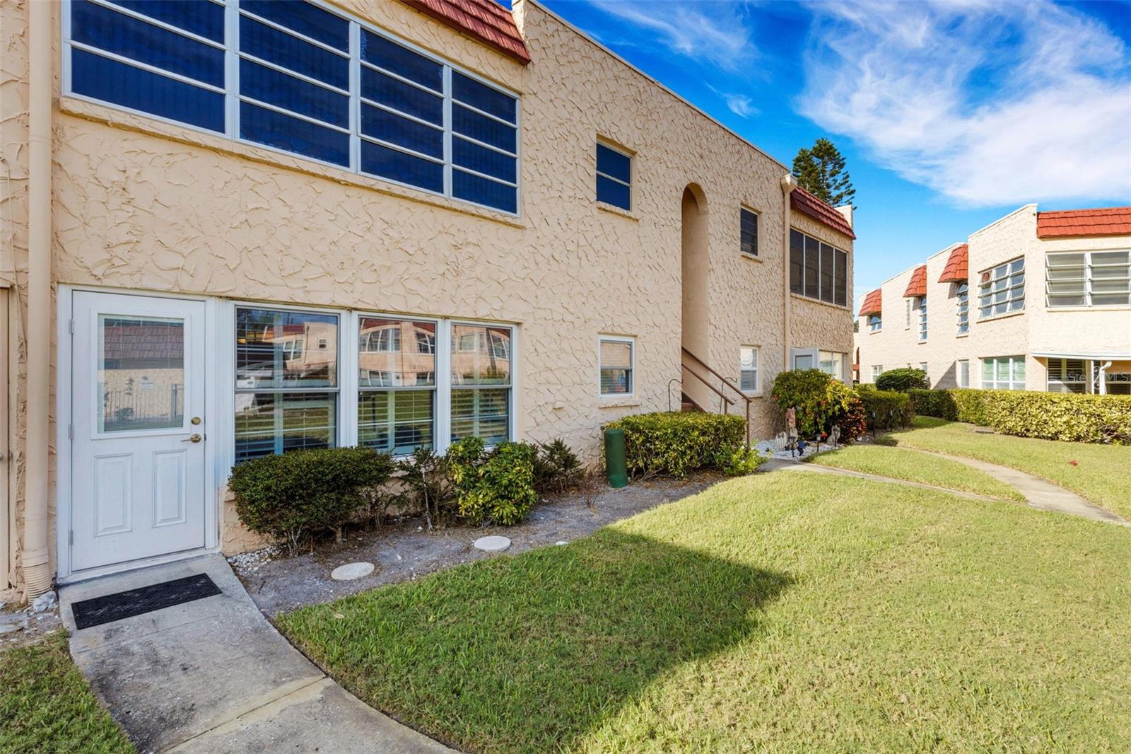 Back of Unit With Pedestrian Door to Pool and Clubhouse
