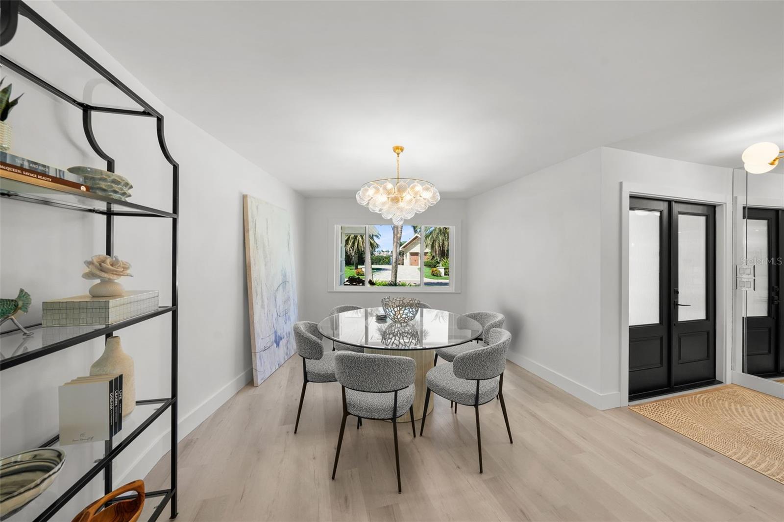 The expansive dining room is designed to accommodate a variety of table sizes and seating arrangements.