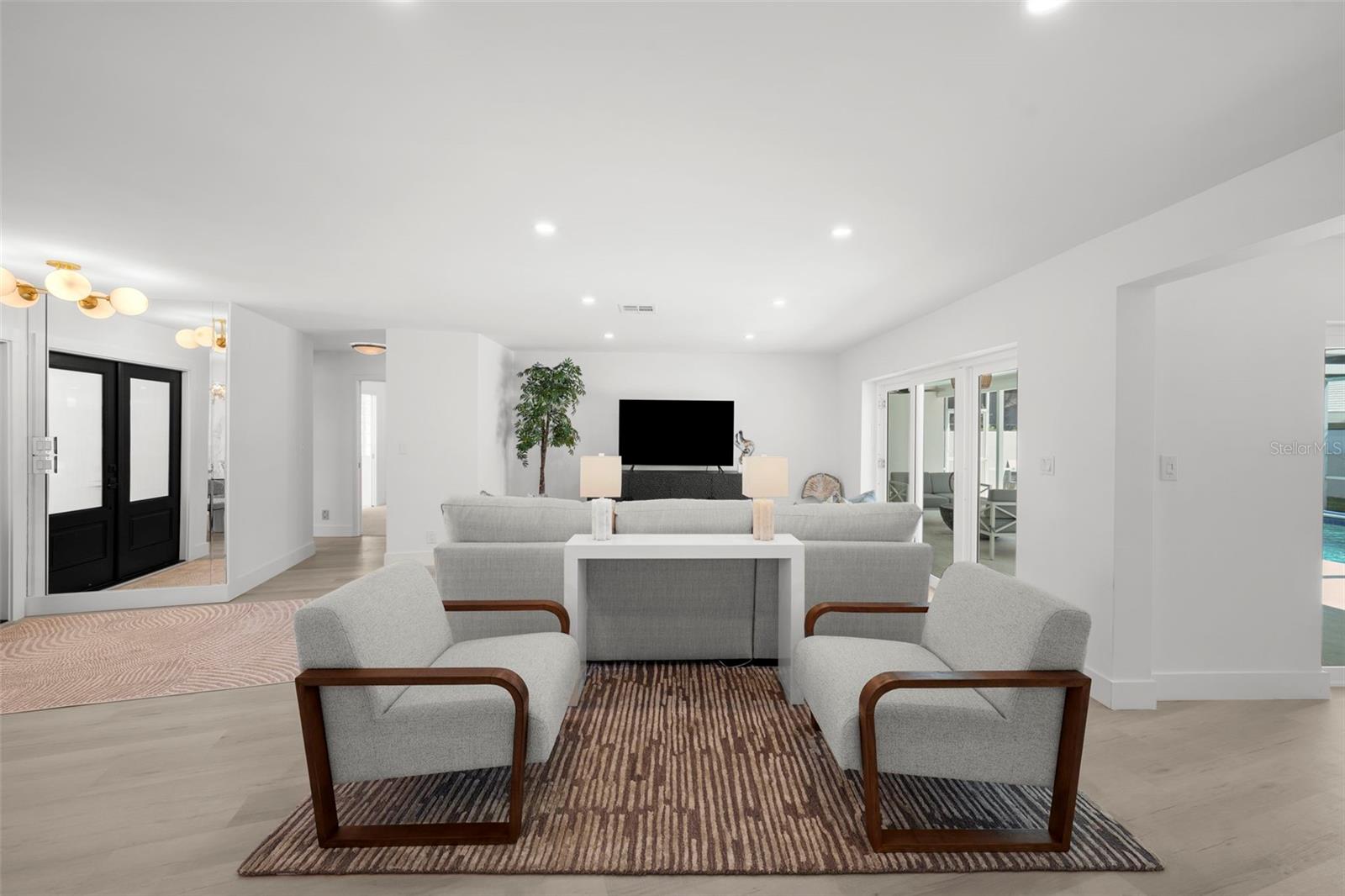 Thoughtfully designed family room offering distinct spaces for both relaxation and conversation.