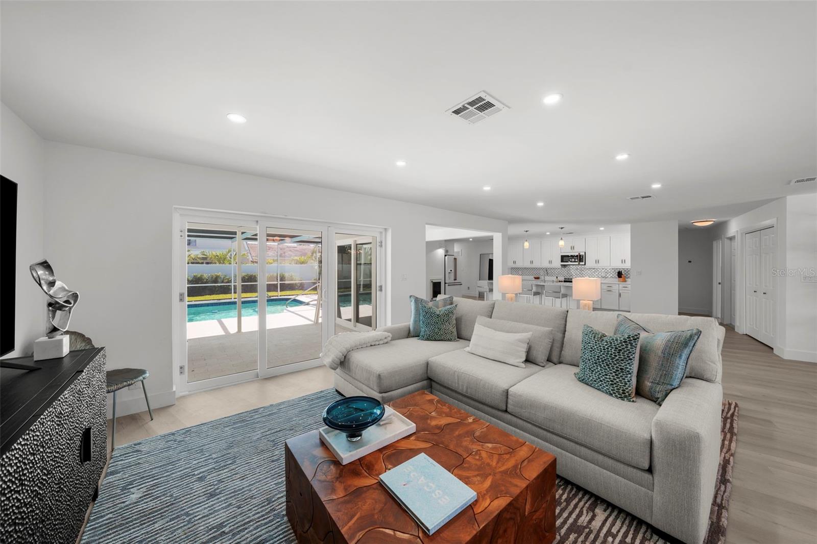 A warm and welcoming family room designed with natural light and elegant design and comfort