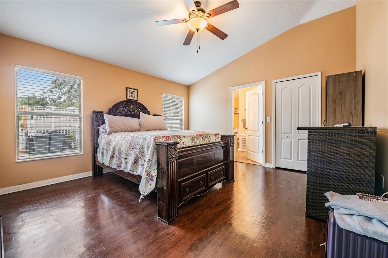 Primary bedroom with walk in closet and full shower bath.