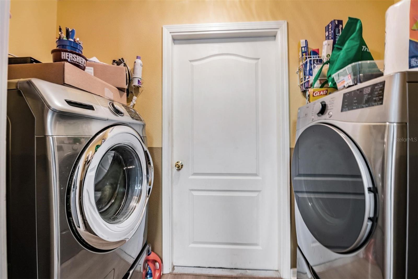Enter the laundry area from the garage into the kitchen. Washer/Dryer convey!