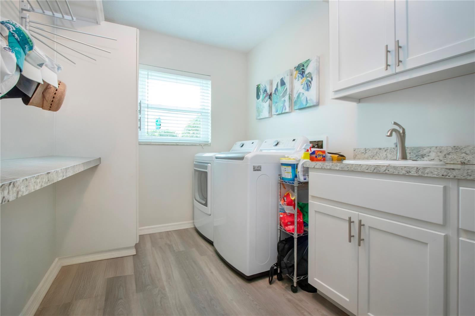 Inside Utility room w/sink/ folding area/extra cabinets