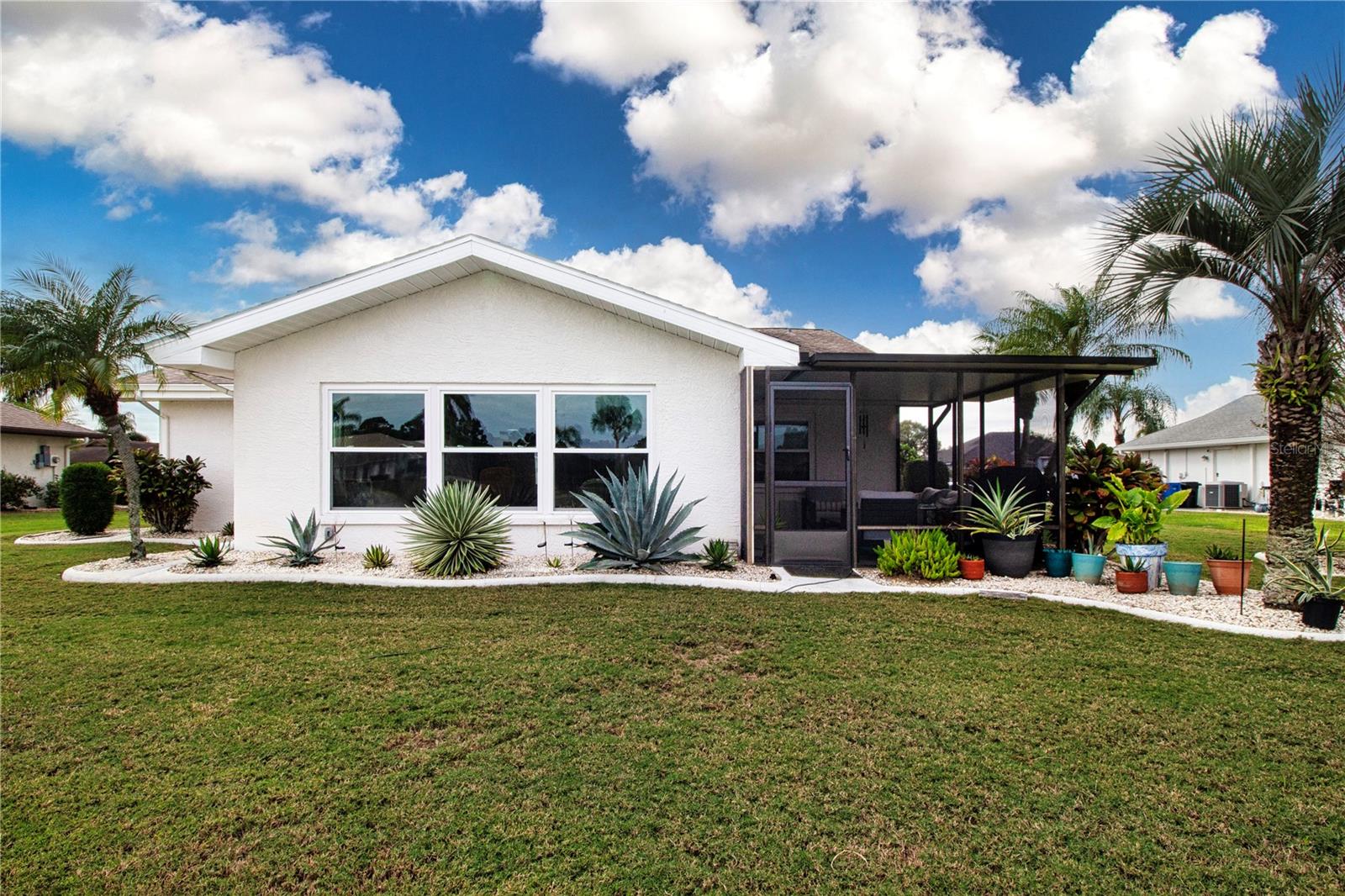 Beautiful tropical succulent landscaping surrounds the home