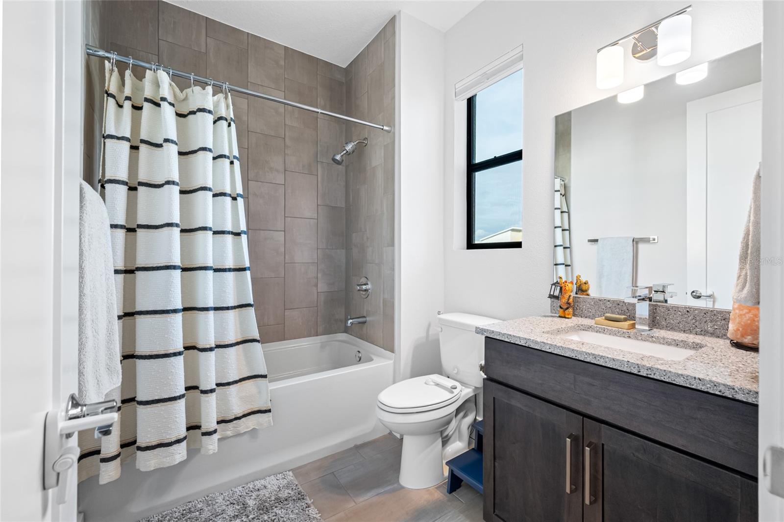 Second bedroom features 10ft ceilings, walk-in closet, and ensuite bathroom with bathtub. Third Floor