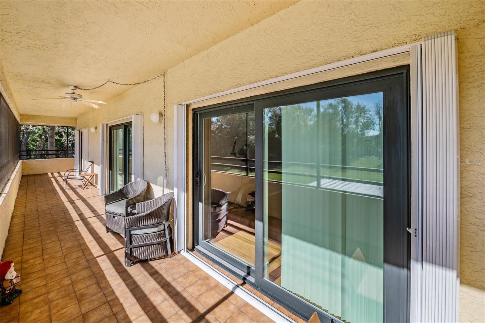 Private balcony with updated heavy updated hurricane proof sliders as well as hurricane shutters.