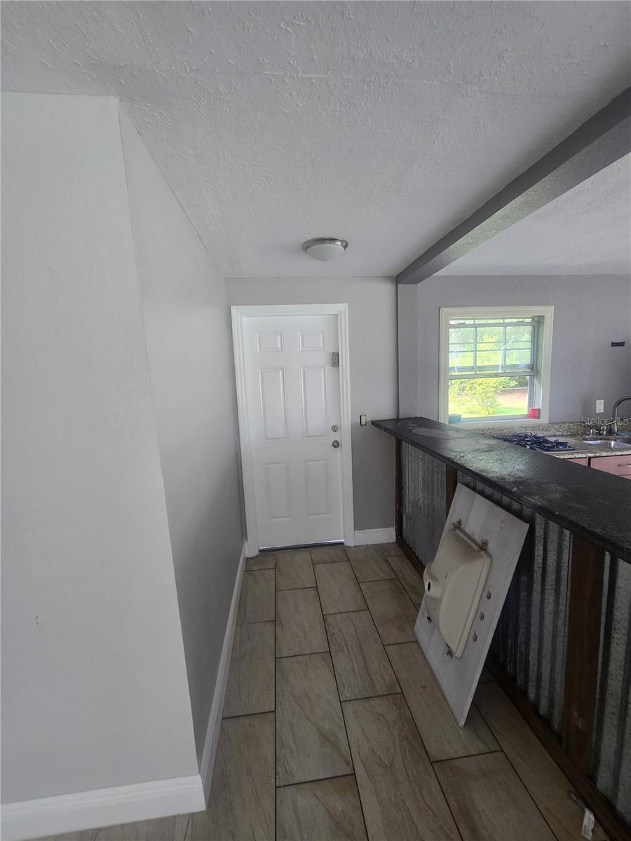 Exit door by outside kitchen and terrace