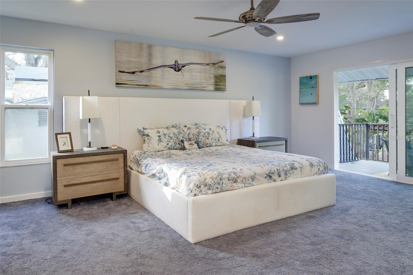 A private balcony off the primary bedroom provides a lofty place to relax and unwind.