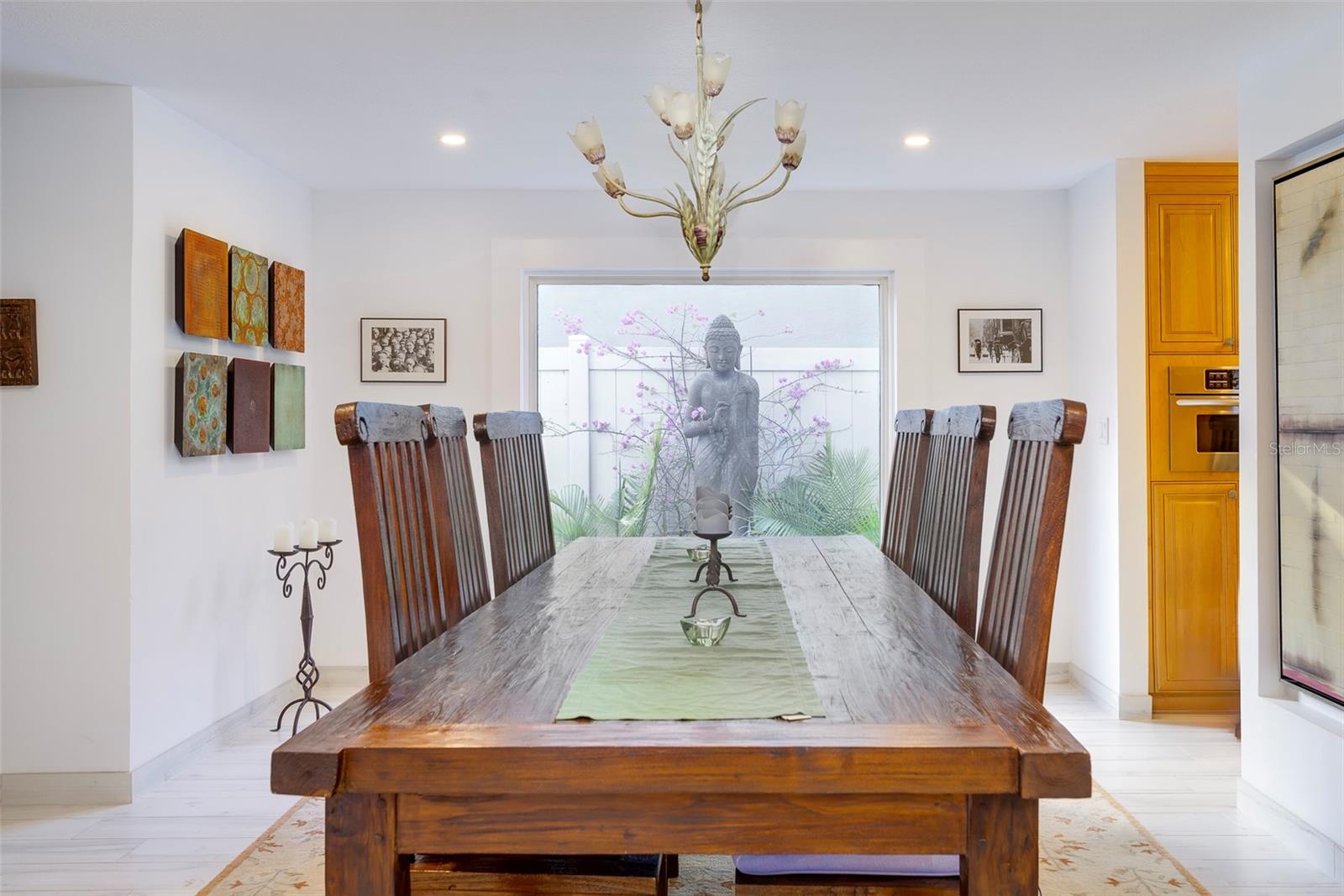 Dining room by day. The antique chandelier has been removed and does not convey.