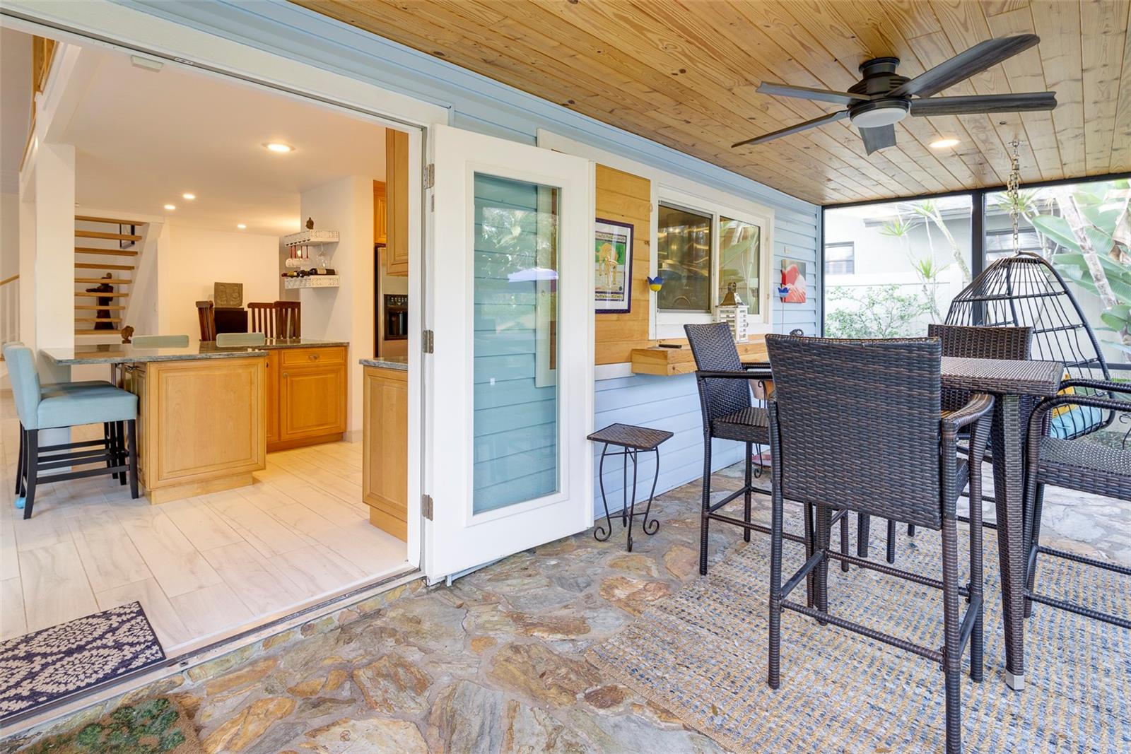 Step outside to the completely rebuilt screened porch with tongue and groove plank ceiling.