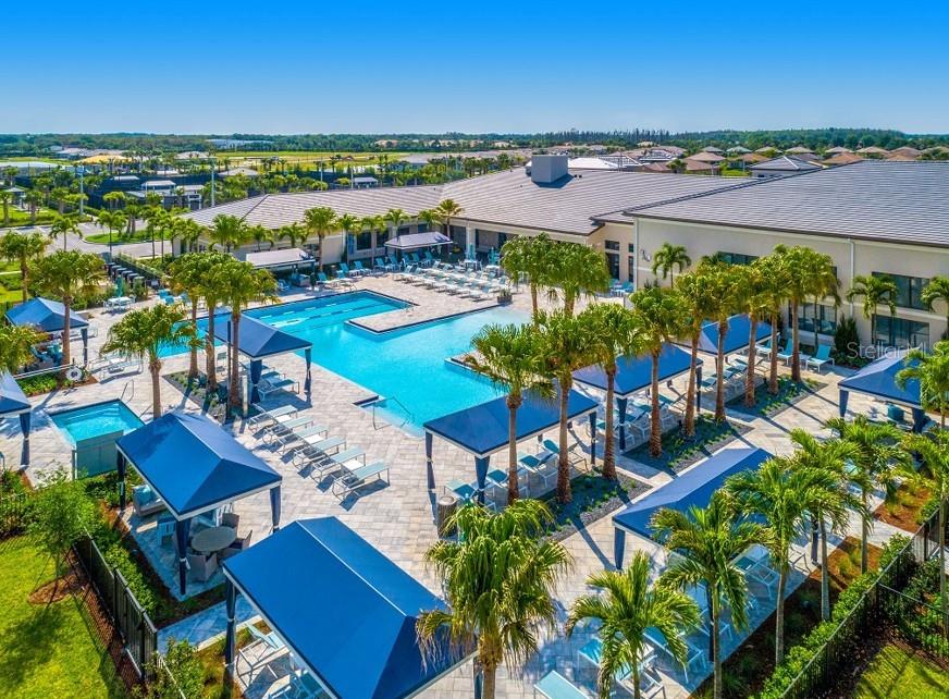 Extra large community pool with cabanas for all day enjoyment