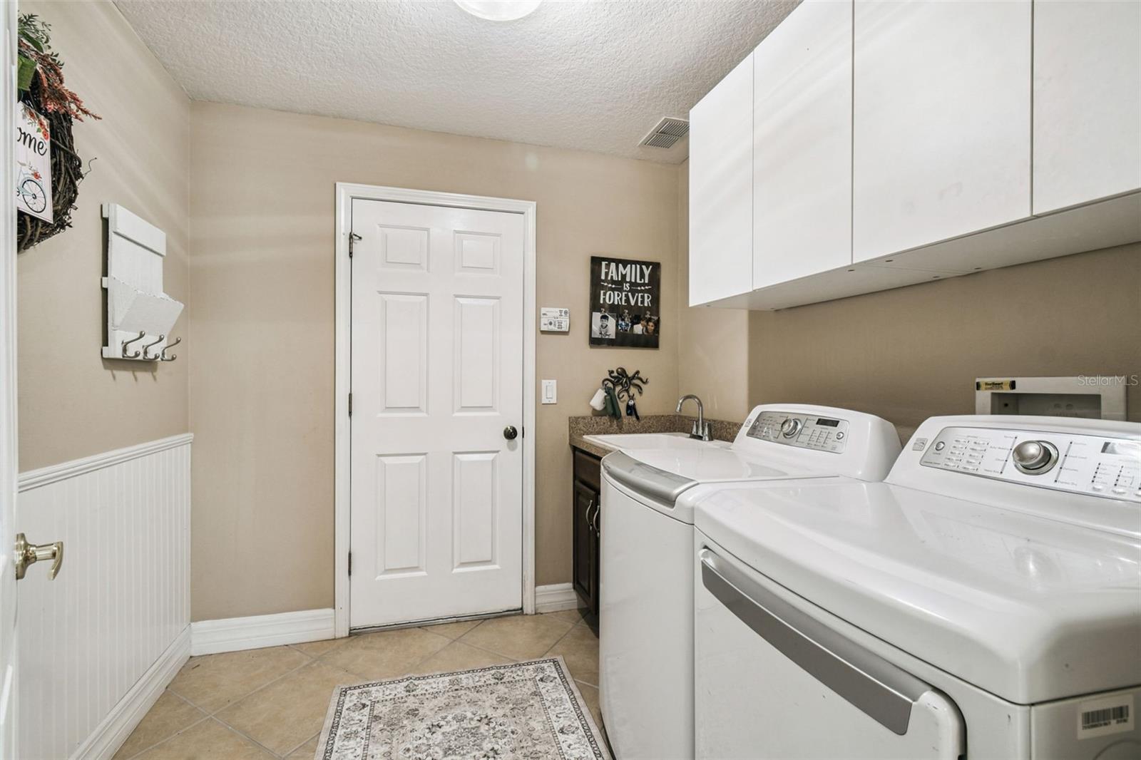 Laundry room with sink