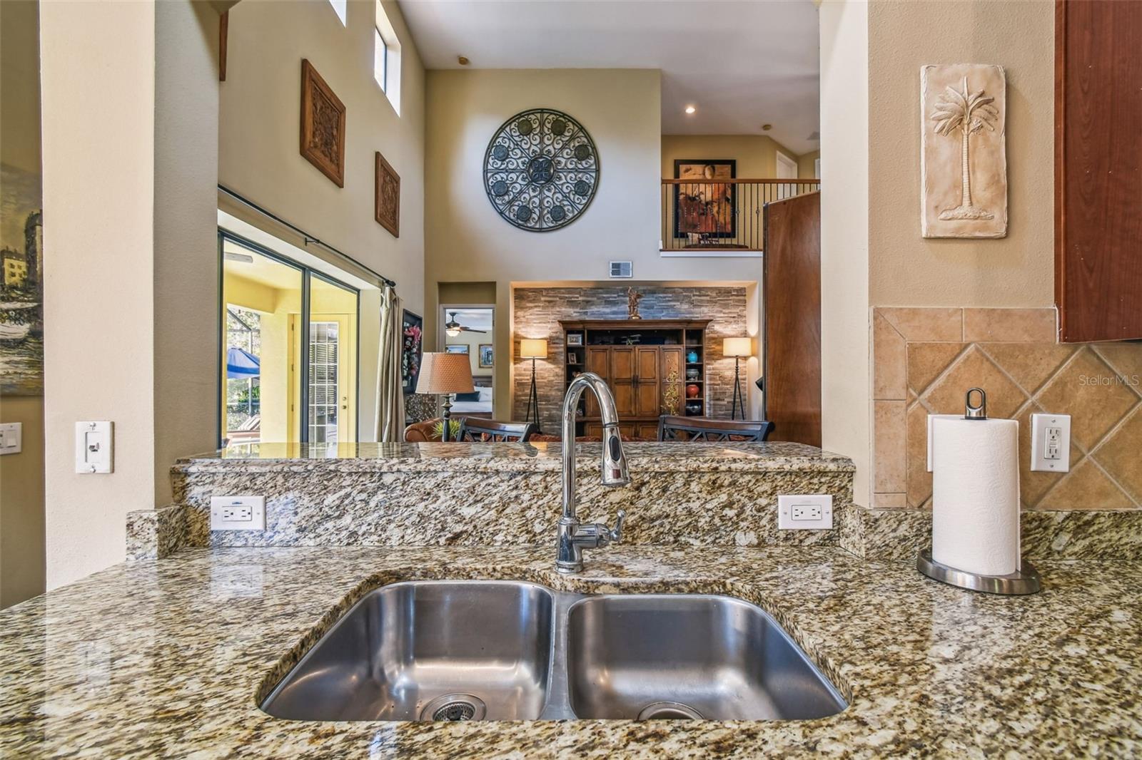 View of two story family room from kitchen