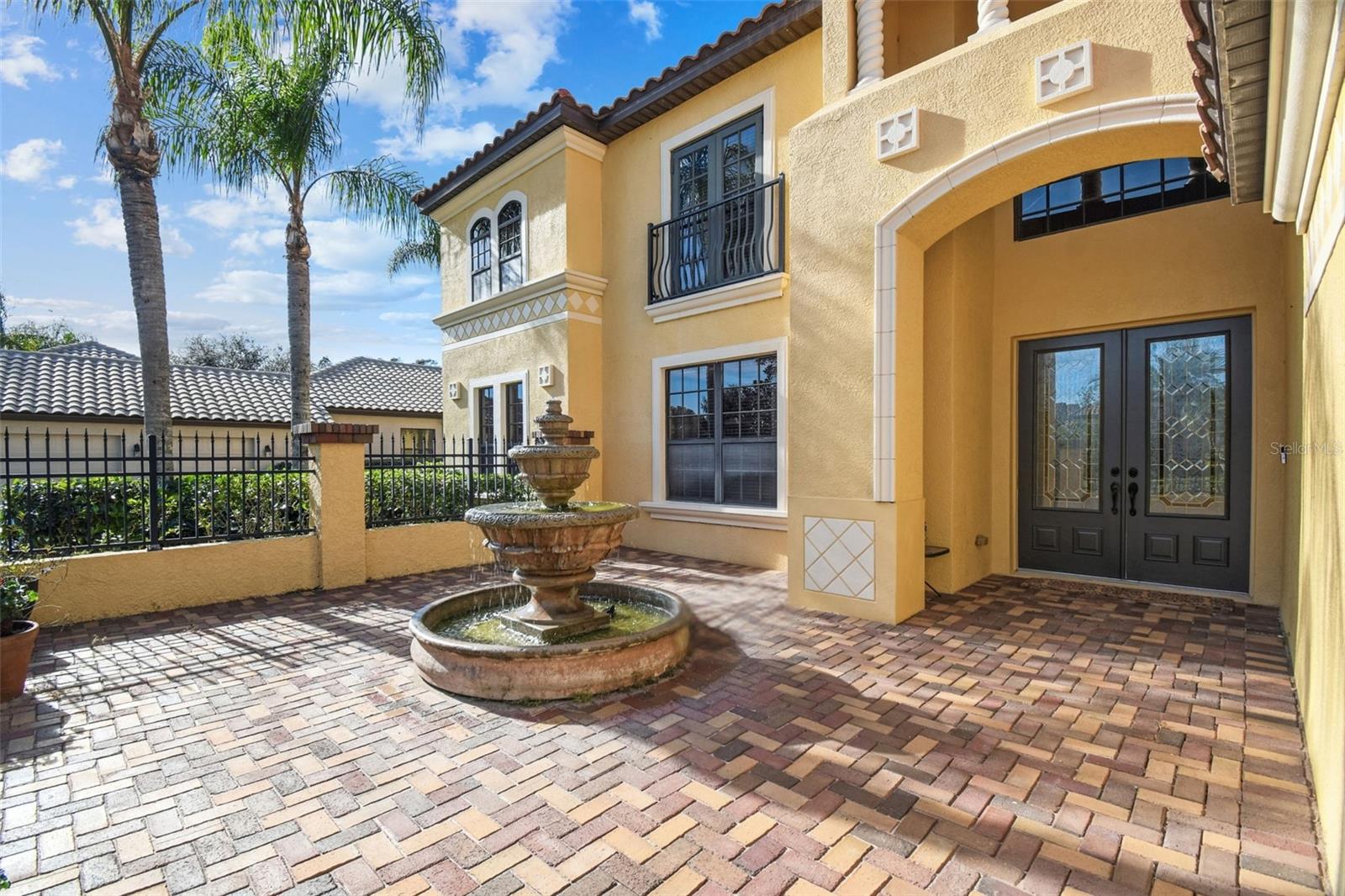 Aluminum fence allow view of custom courtyard