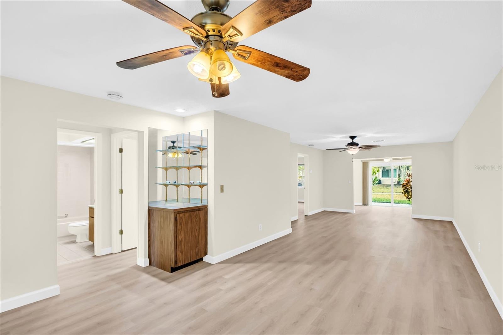 Brand NEW luxury vinyl flooring flows throughout~