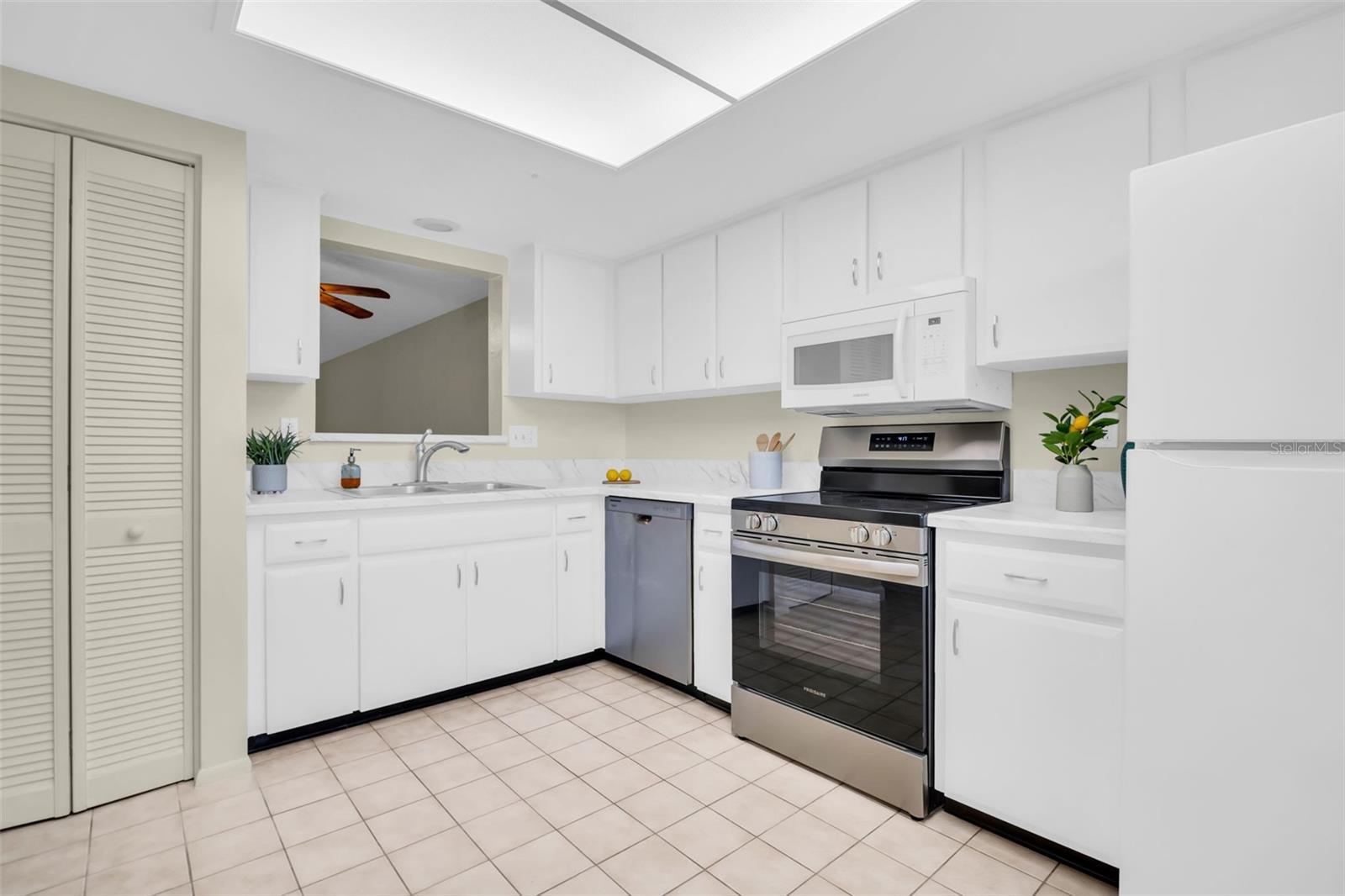 Updated kitchen with brand new dishwasher & range, updated soft close cabinetry, and new lighting~