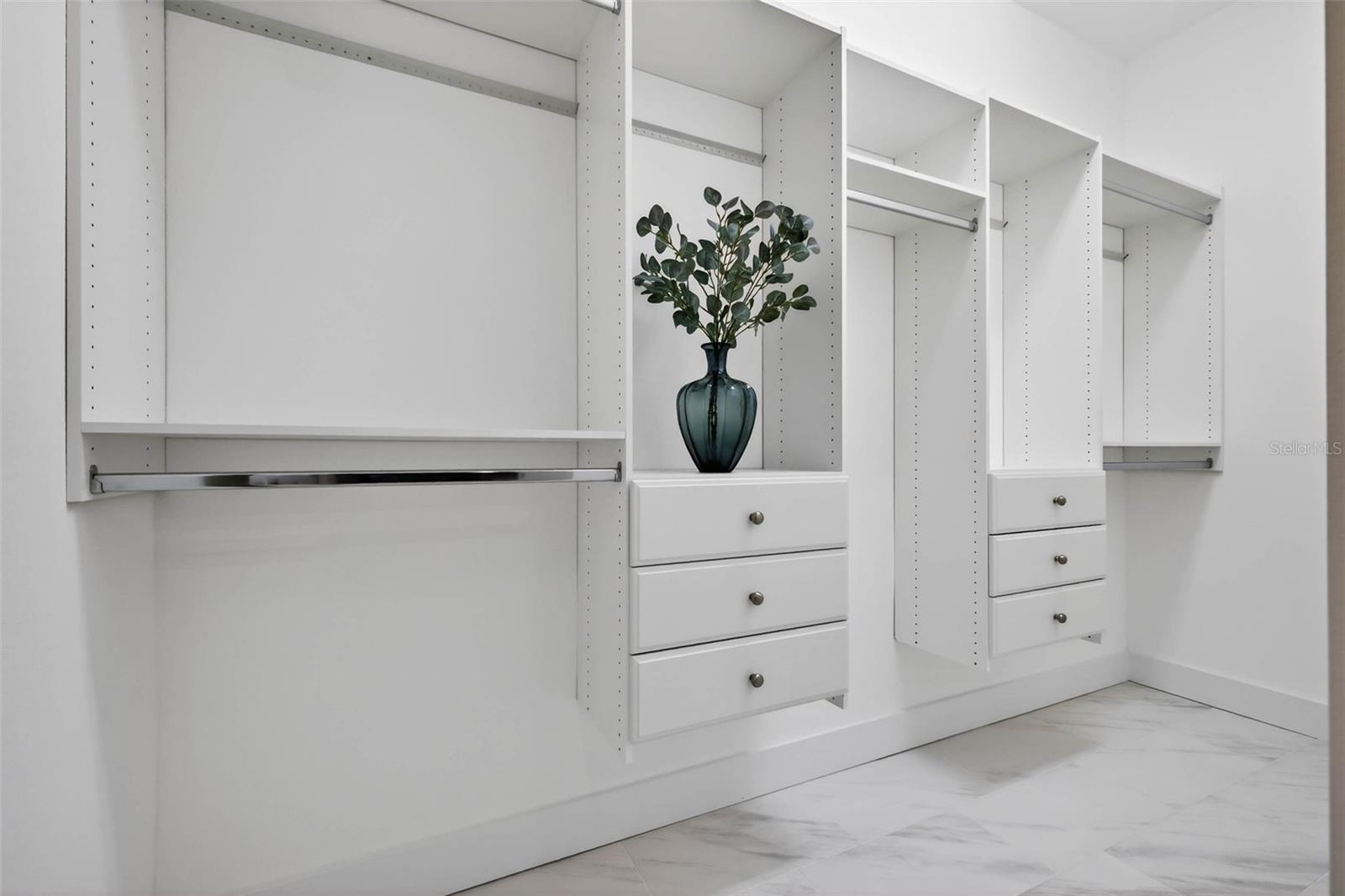 Downstairs primary walk in closet