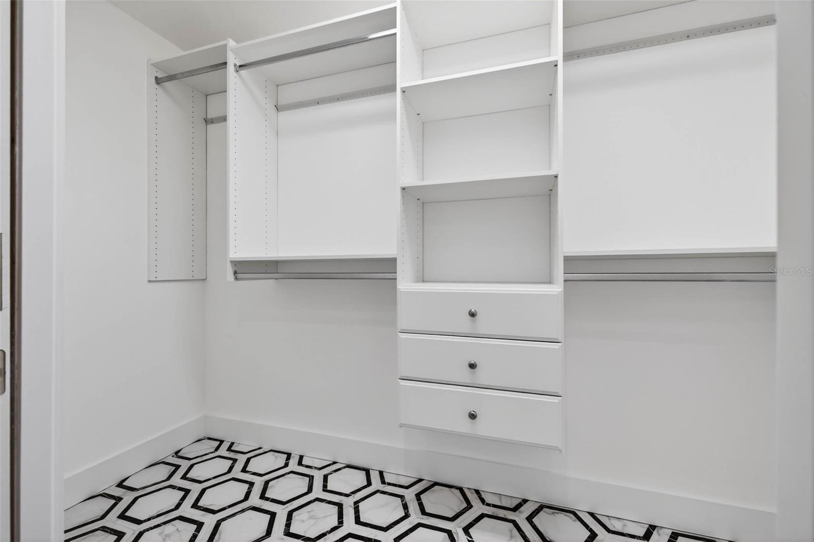 Upstairs primary walk in closet