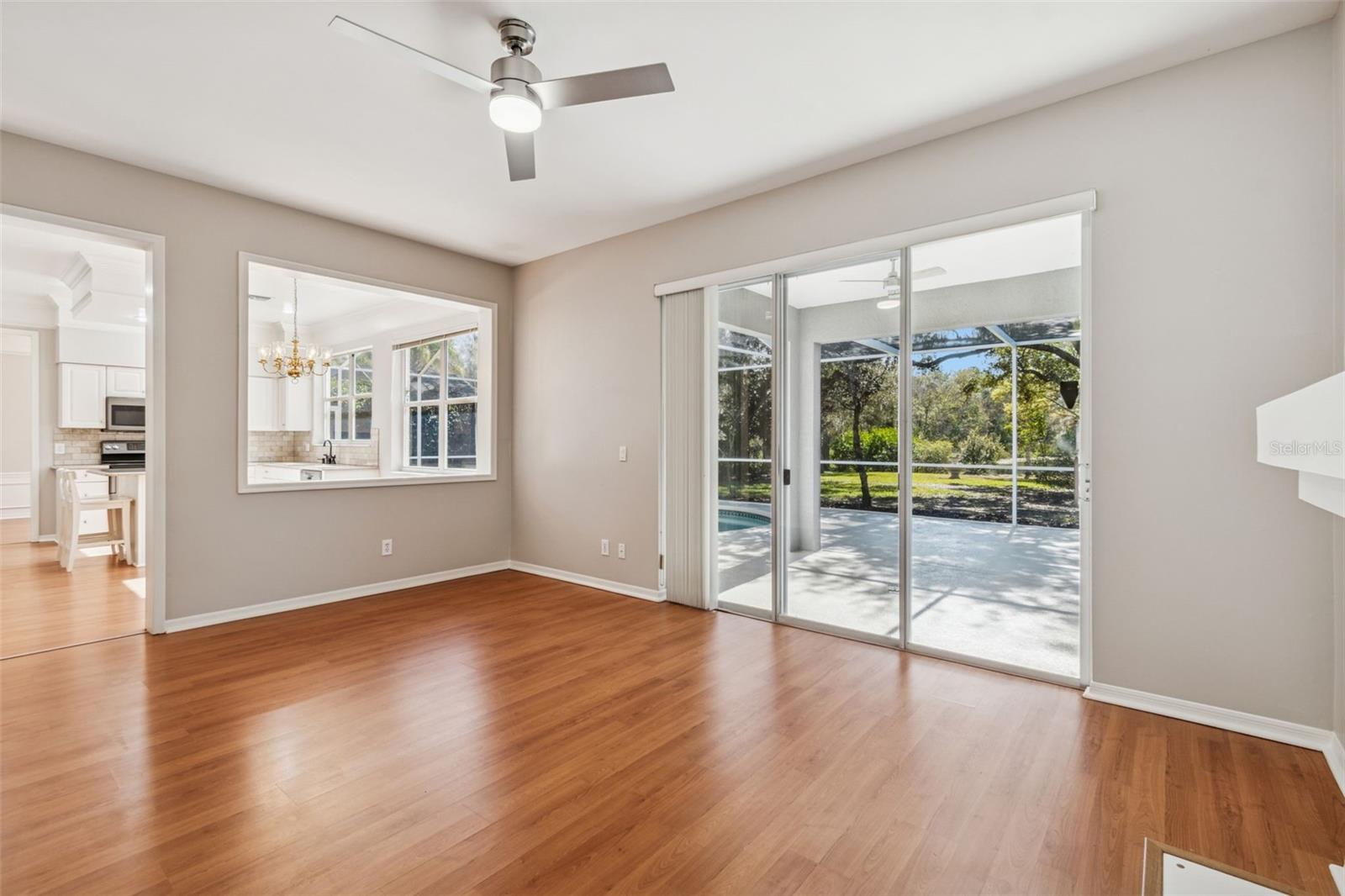 Sliders lead to lanai and pool