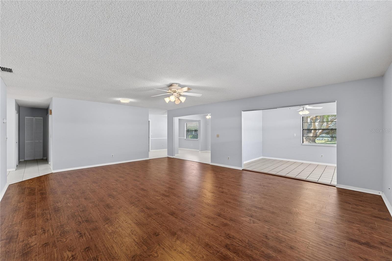 formal living/dining area with view of kitchette, flex room and possible 3rd BR or office