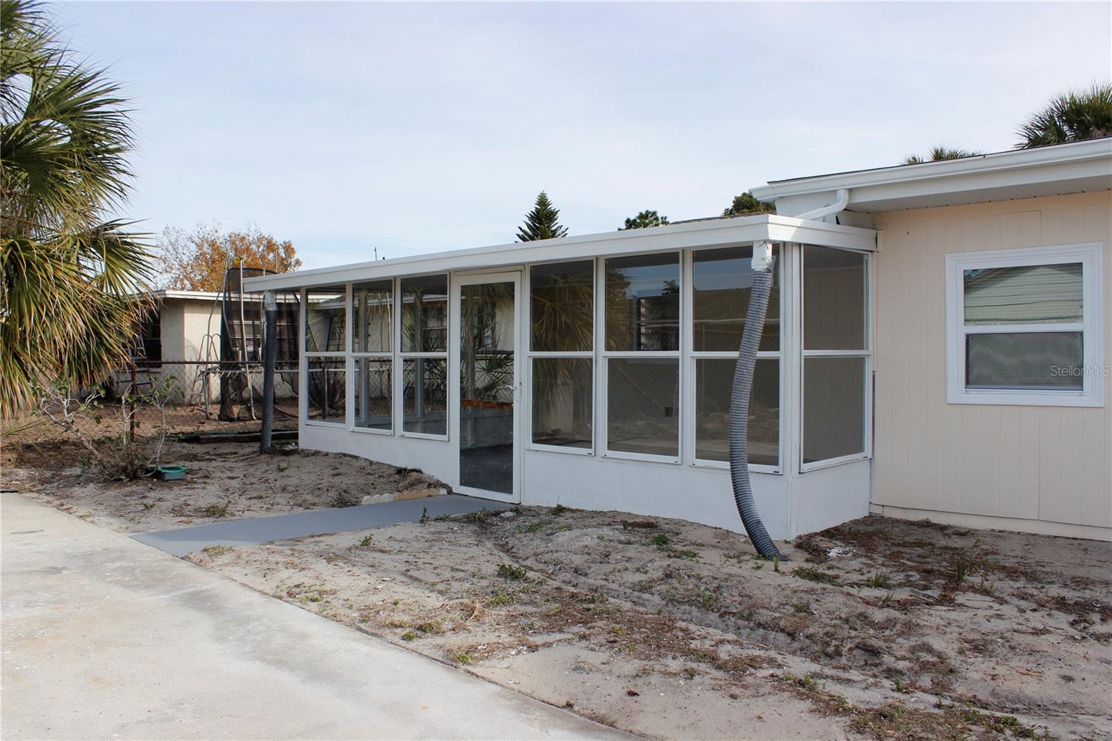 BACK LANAI WITH WINDOWS OUTSIDE VIEW