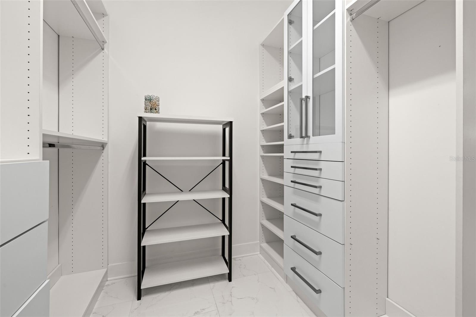Primary his/hers walk-in closets