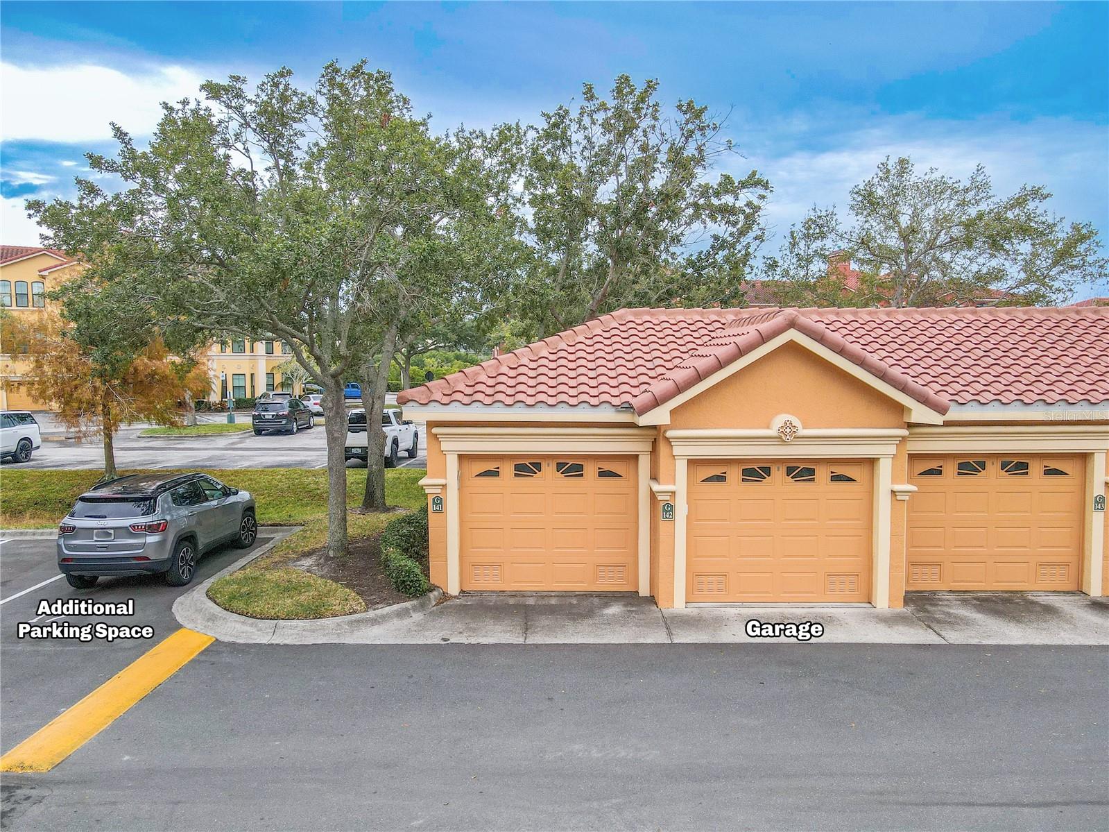 Deeded private garage and 1 assigned parking spot, as noted in the photo, just across from the second floor condo unit.