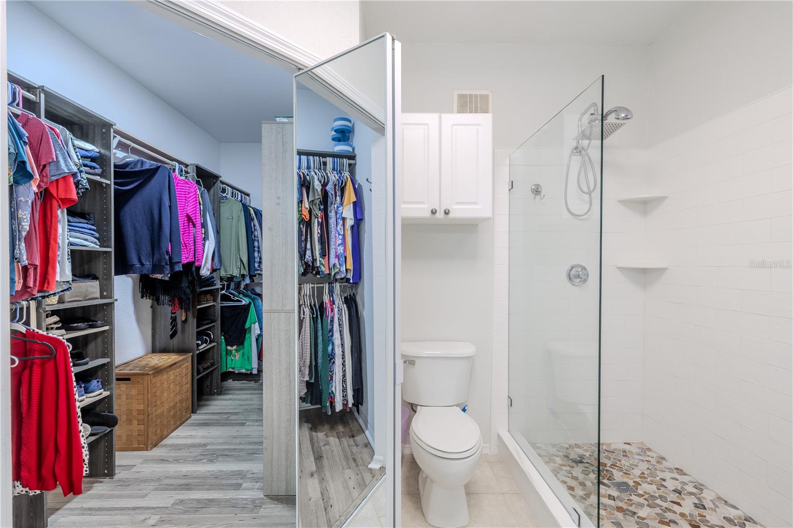 Primary bedroom spacious walk in closet located in the en-suite bathroom.