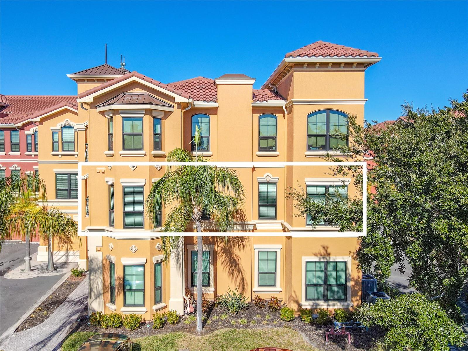Sun-drenched Mediterranean elegance rises above palm-lined grounds, welcoming you to refined waterfront living at The Grand Bellagio 2 bedroom/2bath/den condo.