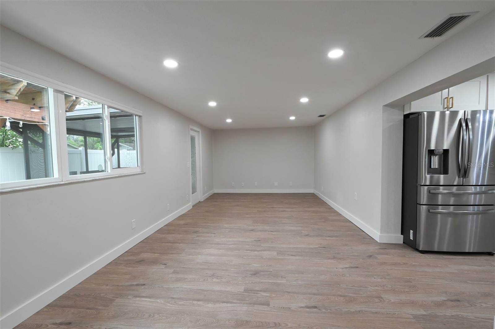 Large family room off kitchen.  French doors out to lanai.