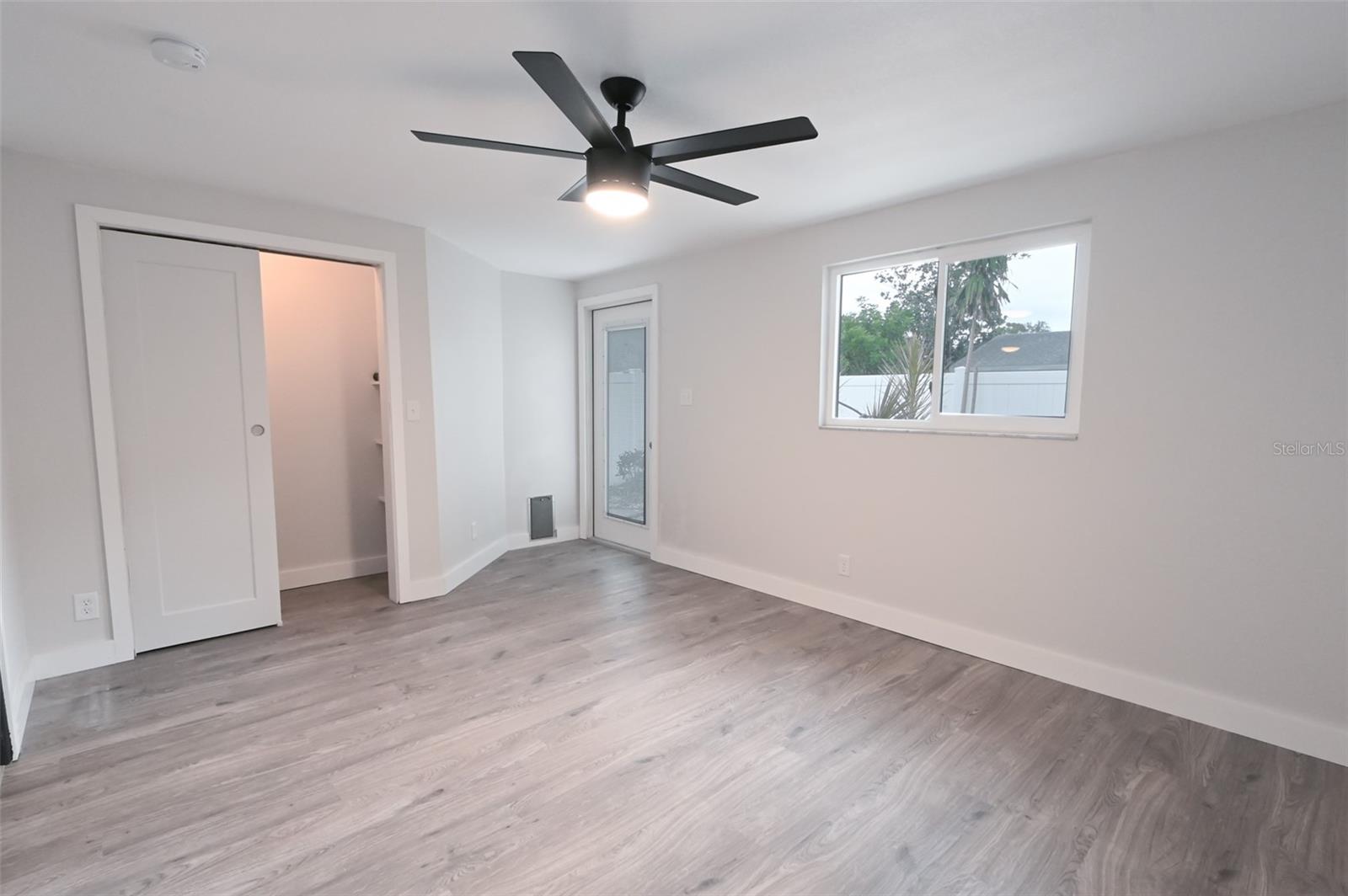 Bonus Room or Bedroom with closet & door to backyard.