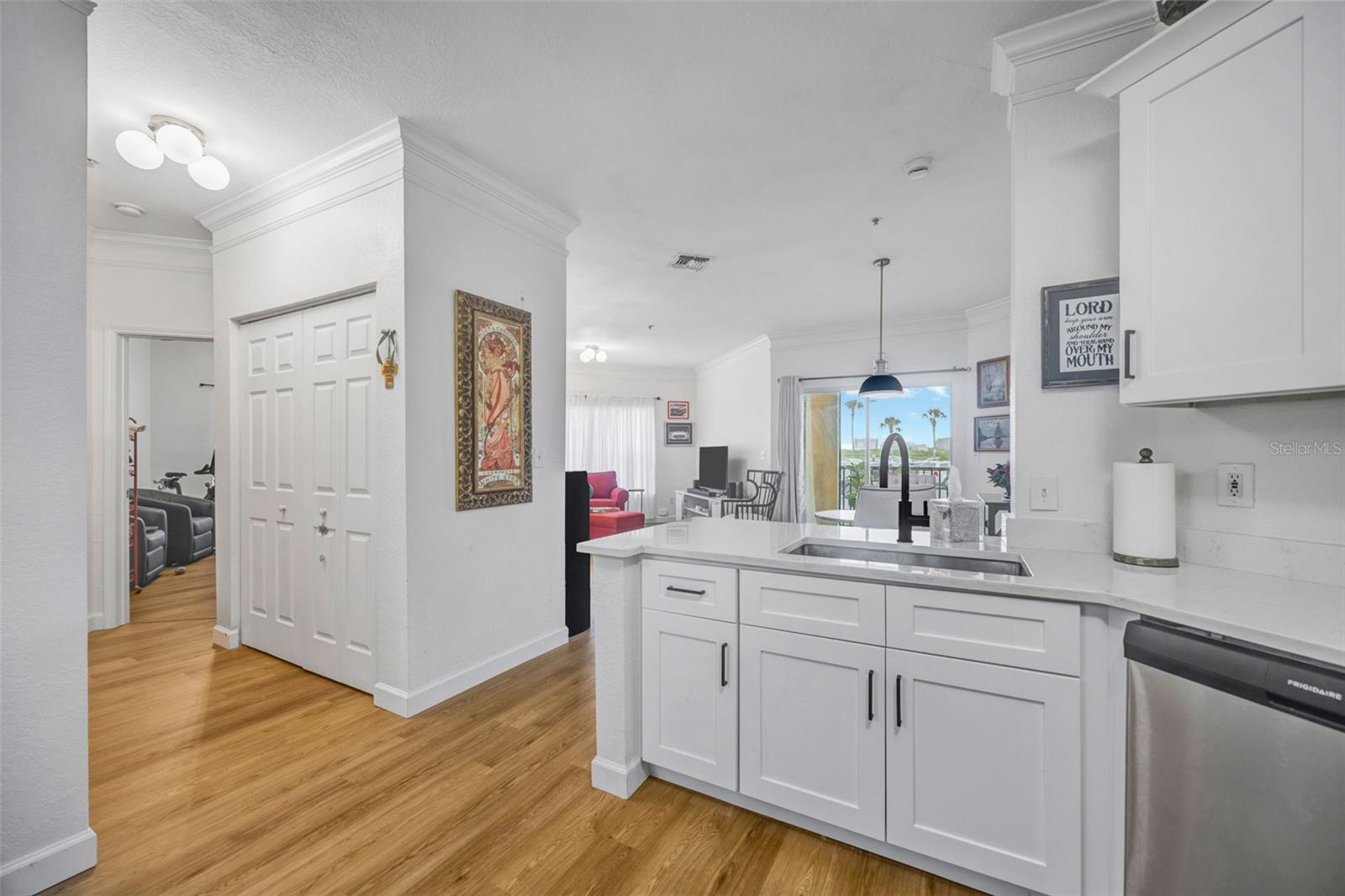Kitchen with view of hallway and living.dining