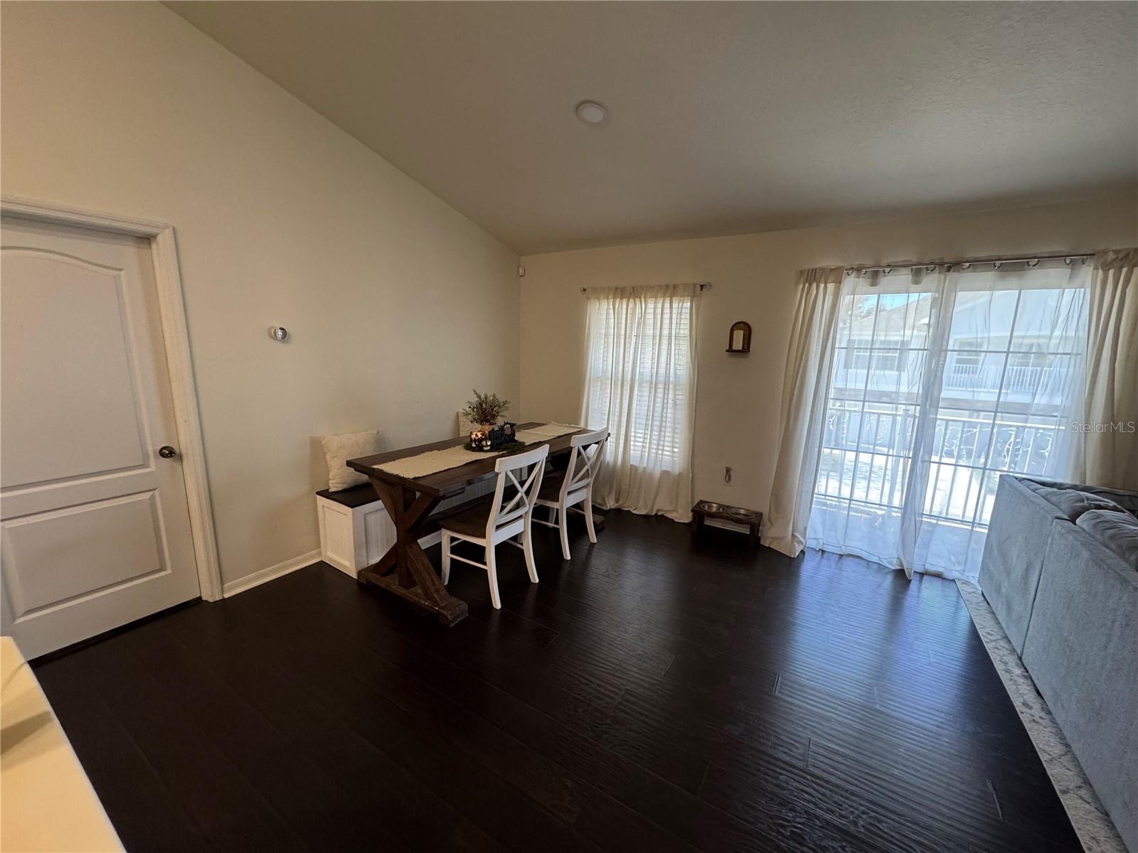 LARGE dining area with entrance to balcony and Master Bedroom