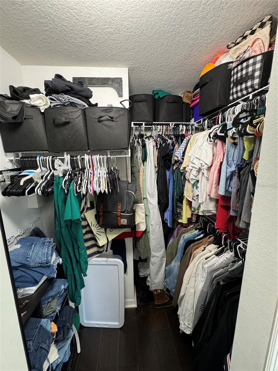 Humungous walk-in closet with tons of storage space