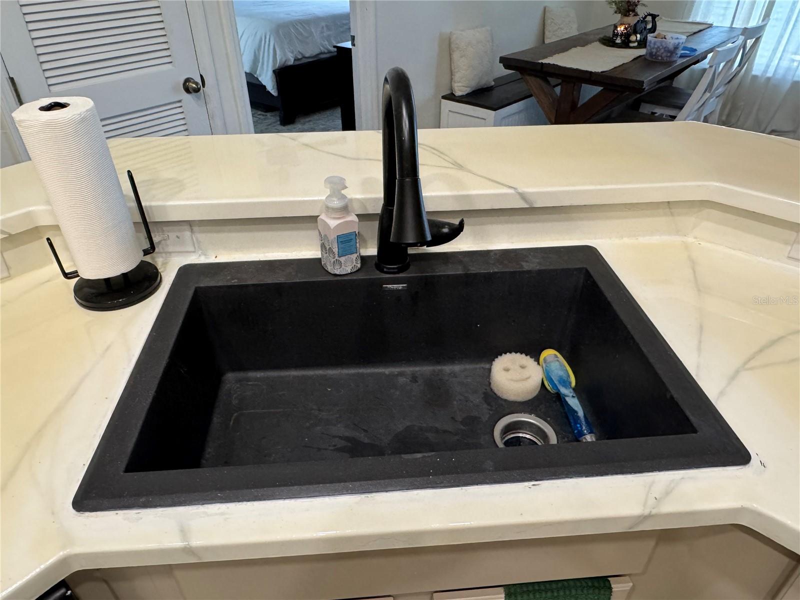 Kraus black STONE sink with extension faucet