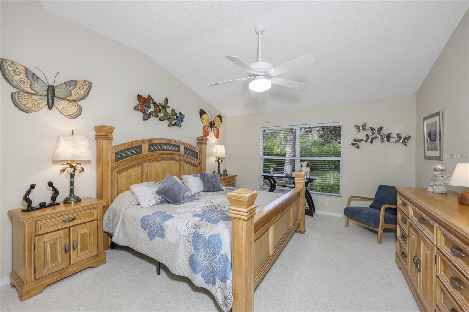 Primary bedroom with a neutral palette.