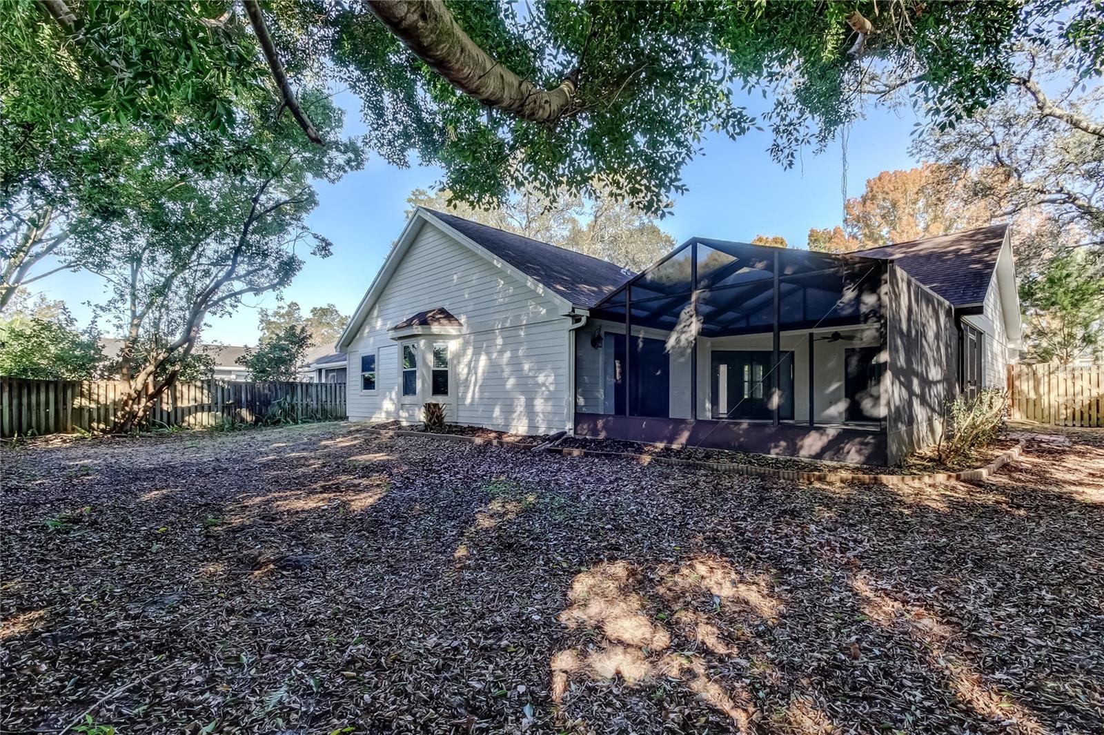 52. Plenty of Shady Trees Line the Perimeter of  this Backyard!!