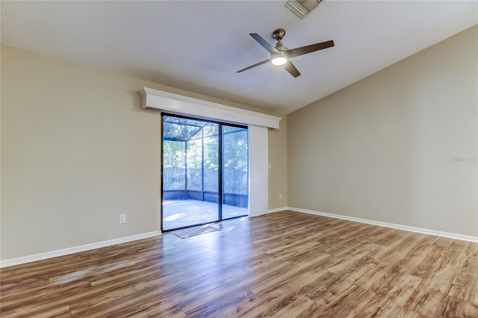 25. Family Room (16.7' x 13.4') Also w Oversized  Sliding Glass Doors  to Outdoor Lanai!!